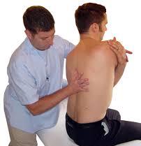 chiropractor treating man