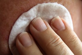 cotton pad on face