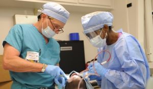 two dentists and patient